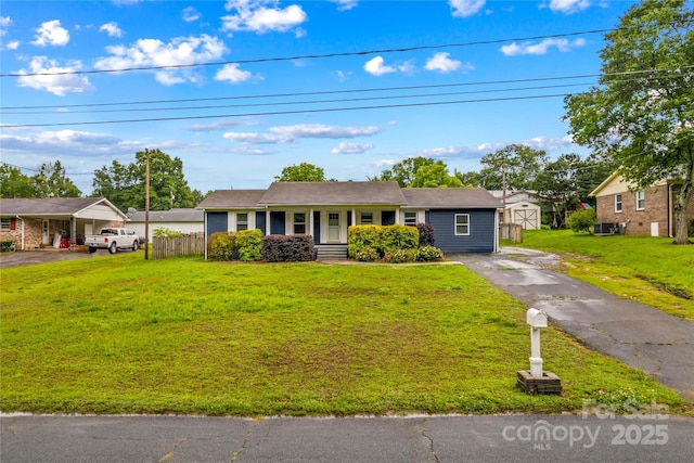 211 Ridgecrest St, Kannapolis, NC 28081 - ranch-style house featuring asphalt driveway, cooling unit, and covered porch