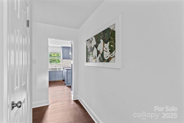 211 Ridgecrest St, Kannapolis, NC 28081 - hall featuring dark wood-style flooring, baseboards, and a sink