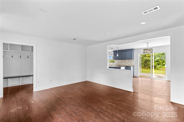 211 Ridgecrest St, Kannapolis, NC 28081 - unfurnished living room with wood finished floors, baseboards, and recessed lighting