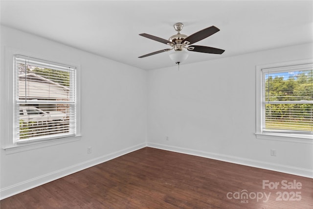 211 Ridgecrest St, Kannapolis, NC 28081 - unfurnished room featuring dark wood-style floors, plenty of natural light, and baseboards