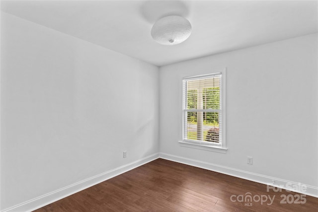 211 Ridgecrest St, Kannapolis, NC 28081 - empty room featuring dark wood-style floors and baseboards