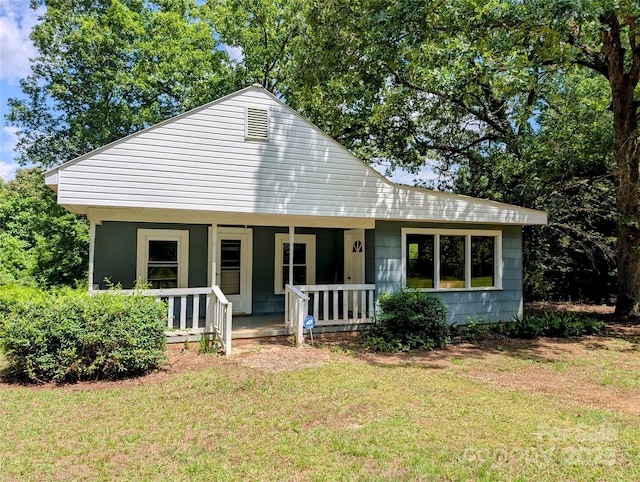 bungalow featuring a porch and a front yard