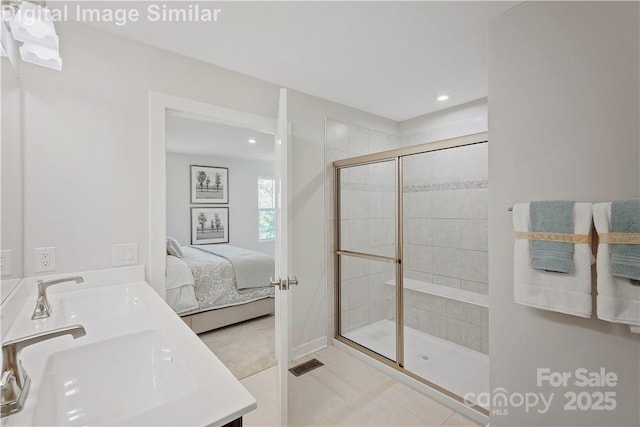 577 Nesbe St Unit 2222, Lancaster, SC 29720 - bathroom featuring double vanity, a stall shower, recessed lighting, ensuite bathroom, and tile patterned flooring