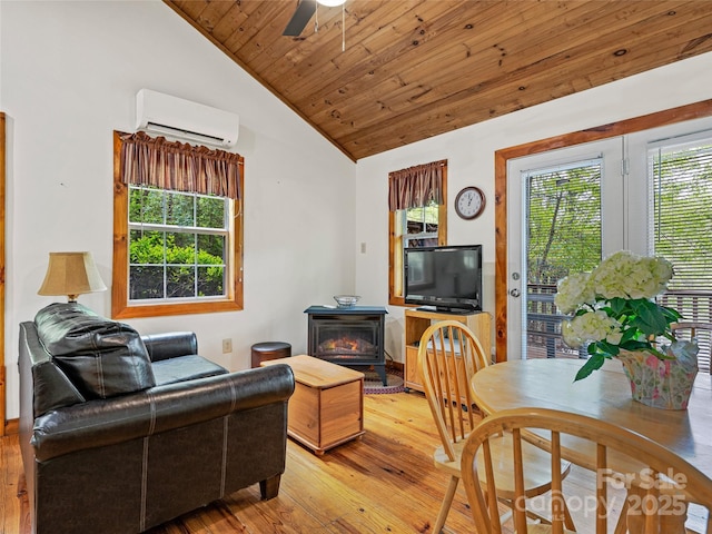 living room featuring a wood stove, an AC wall unit, lofted ceiling, hardwood / wood-style flooring, and wooden ceiling