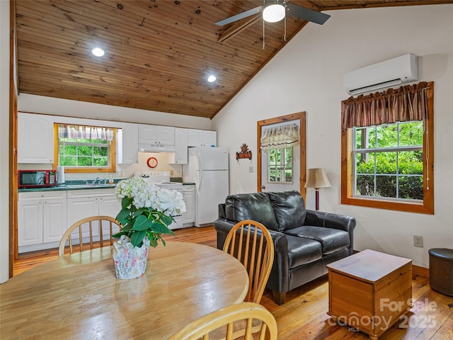 dining room featuring a wall mounted AC, a ceiling fan, light wood-style floors, wooden ceiling with exposed beams, and high vaulted ceiling