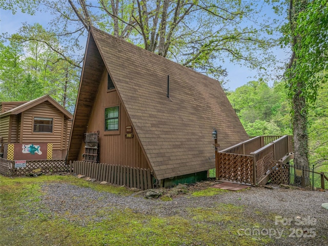 view of home's exterior featuring a shingled roof