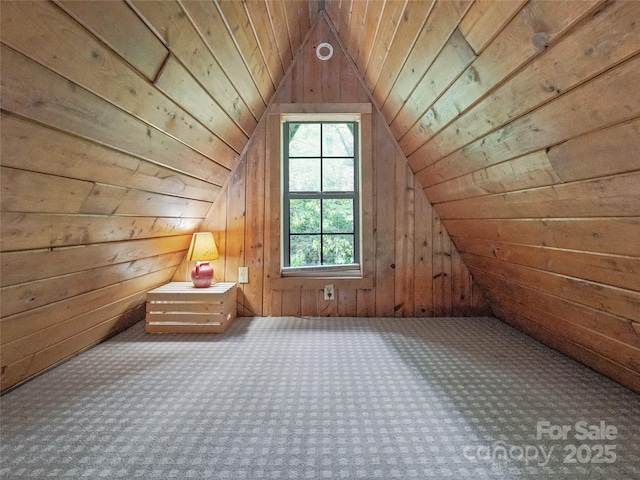 additional living space featuring wooden walls, carpet flooring, vaulted ceiling, and wooden ceiling