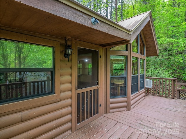 wooden deck featuring a wall mounted AC