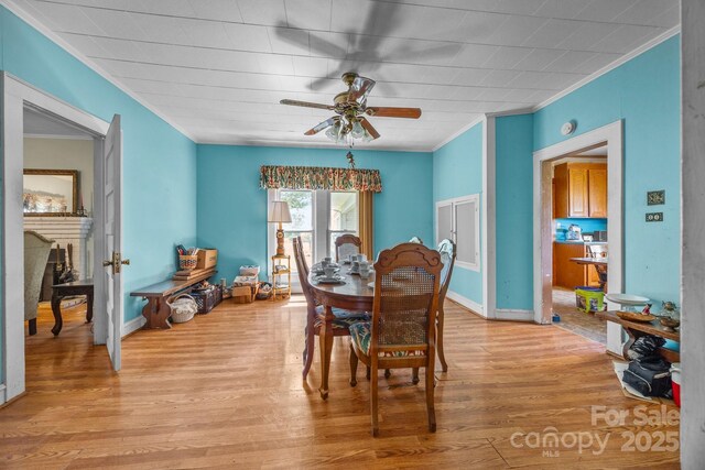 18070 Old Beatty Ford Rd, Gold Hill, NC 28071 - dining room featuring ornamental molding, wood finished floors, ceiling fan, and baseboards