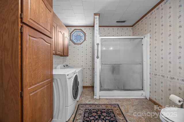 18070 Old Beatty Ford Rd, Gold Hill, NC 28071 - laundry area with wallpapered walls, ornamental molding, washing machine and clothes dryer, and baseboards