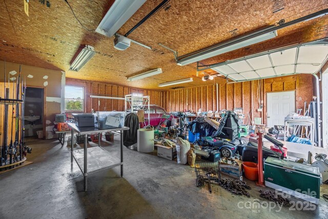 18070 Old Beatty Ford Rd, Gold Hill, NC 28071 - garage with a garage door opener and a workshop area