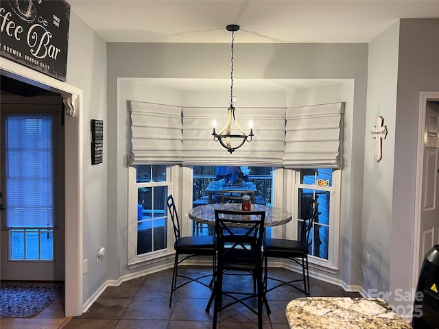 208 Stone Ridge Dr, Salisbury, NC 28146 - dining area featuring baseboards, a chandelier, and dark tile patterned flooring