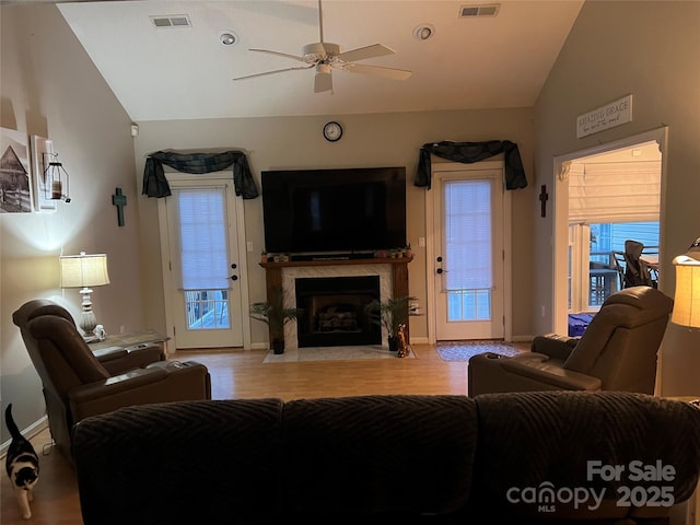 208 Stone Ridge Dr, Salisbury, NC 28146 - living area with lofted ceiling, ceiling fan, a fireplace, baseboards, and wood finished floors