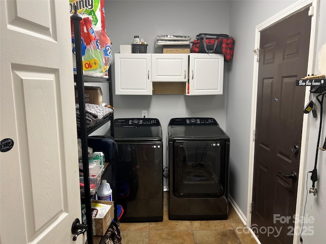 208 Stone Ridge Dr, Salisbury, NC 28146 - laundry area with cabinet space, washing machine and dryer, and light tile patterned floors