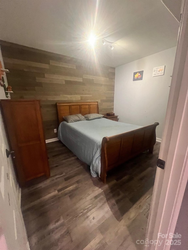 208 Stone Ridge Dr, Salisbury, NC 28146 - bedroom with dark wood-style floors, wood walls, and lofted ceiling