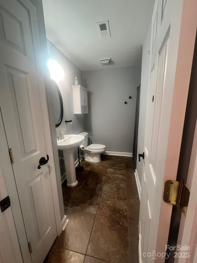 208 Stone Ridge Dr, Salisbury, NC 28146 - bathroom with toilet and baseboards
