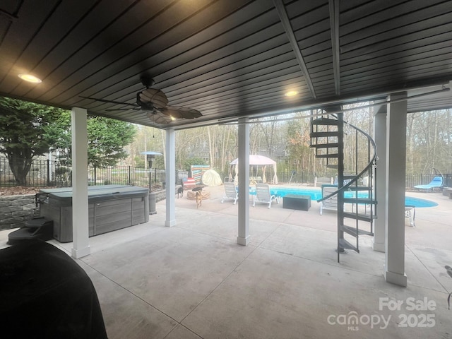 208 Stone Ridge Dr, Salisbury, NC 28146 - fenced backyard featuring a hot tub, a patio, a ceiling fan, and a gazebo