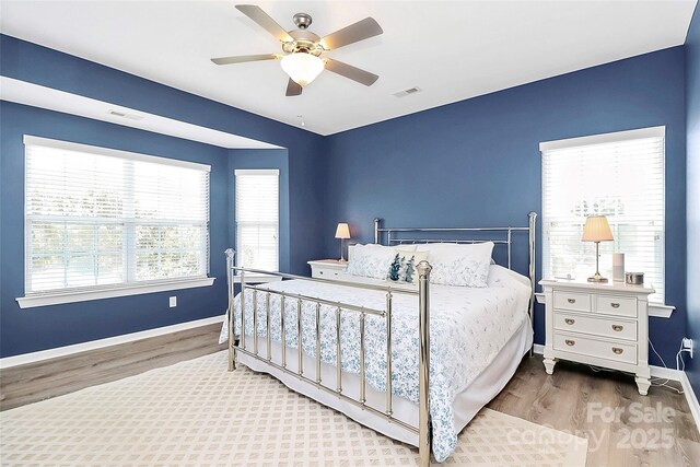 1618 Bay Meadows Ave NW, Concord, NC 28027 - bedroom with wood finished floors, baseboards, and ceiling fan