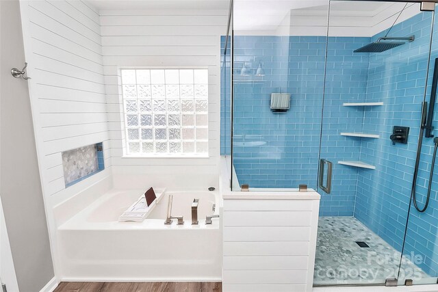1618 Bay Meadows Ave NW, Concord, NC 28027 - full bathroom with a bath, wood finished floors, a shower stall, and plenty of natural light