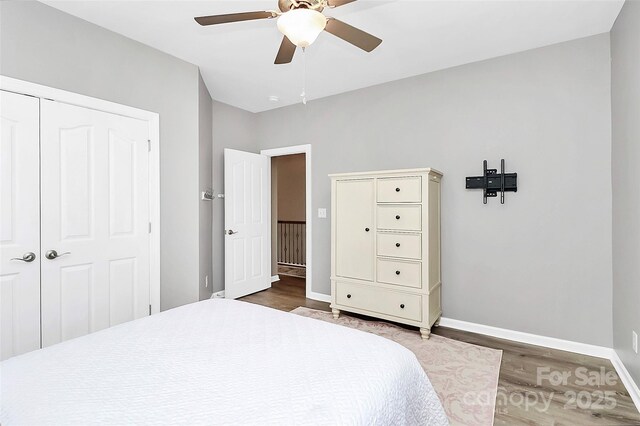 1618 Bay Meadows Ave NW, Concord, NC 28027 - bedroom featuring wood finished floors, baseboards, a ceiling fan, and a closet