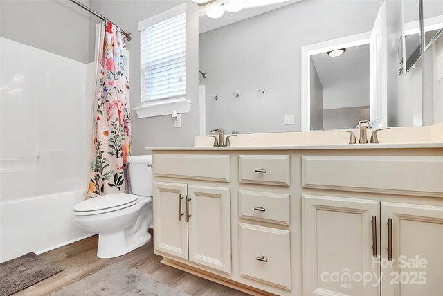 1618 Bay Meadows Ave NW, Concord, NC 28027 - bathroom with wood finished floors, double vanity, toilet, and shower / bath combo