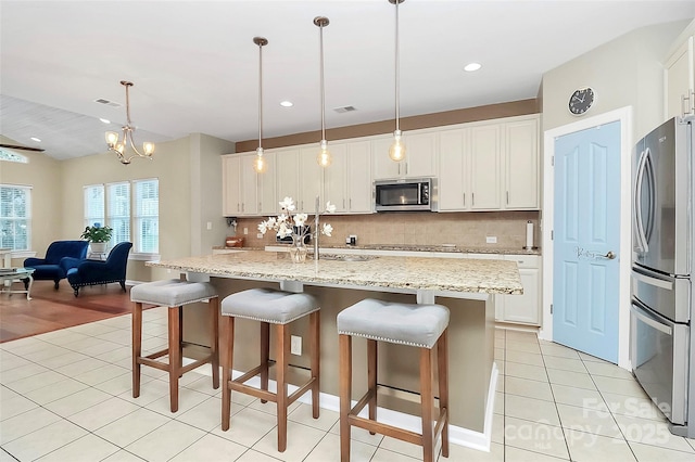 1618 Bay Meadows Ave NW, Concord, NC 28027 - kitchen featuring appliances with stainless steel finishes, backsplash, light tile patterned floors, and recessed lighting