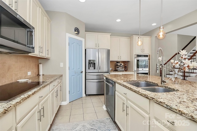 1618 Bay Meadows Ave NW, Concord, NC 28027 - kitchen featuring stainless steel appliances, a sink, tasteful backsplash, hanging light fixtures, and recessed lighting