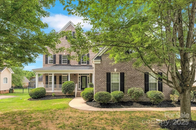 6718 Heritage Orchard Way, Huntersville, NC 28078 - traditional-style home featuring a porch and brick siding