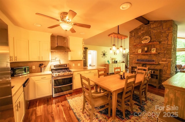 571 Ivy Ridge Cir, Sylva, NC 28779 - dining space featuring wood finished floors, ceiling fan, a fireplace, and recessed lighting