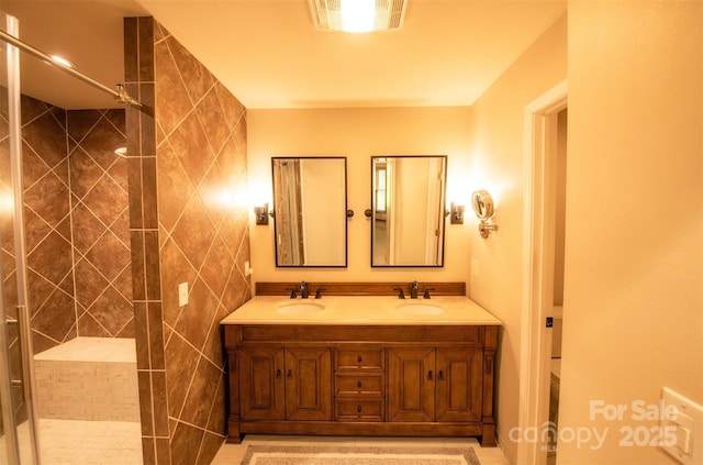 571 Ivy Ridge Cir, Sylva, NC 28779 - full bathroom with a tile shower and double vanity