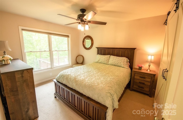 571 Ivy Ridge Cir, Sylva, NC 28779 - carpeted bedroom with ceiling fan and baseboards