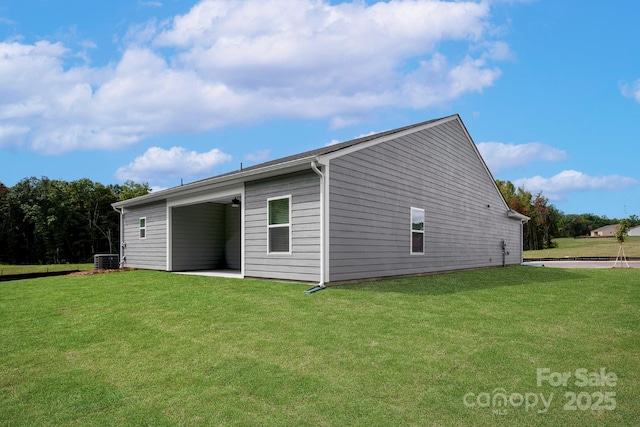 7121 Jerimoth Dr, Charlotte, NC 28215 - back of property with a lawn, central air condition unit, a patio area, and a ceiling fan
