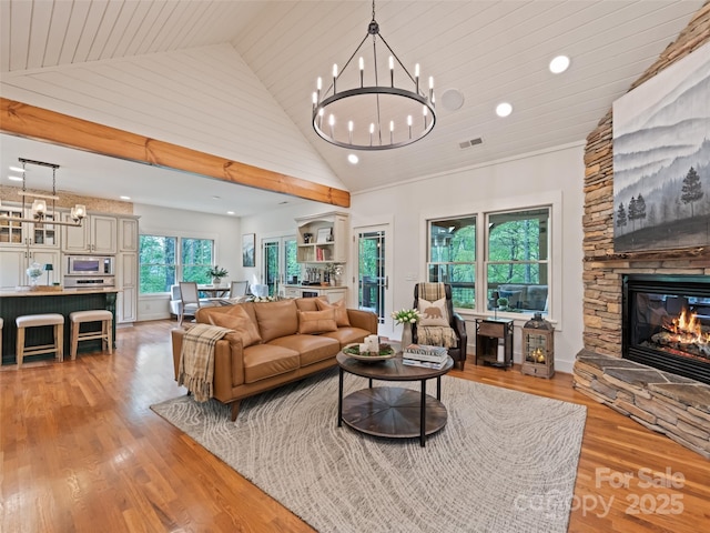 62 Blair Athel Pt, Waynesville, NC 28786 - living room featuring a chandelier, a fireplace, light wood-type flooring, recessed lighting, and high vaulted ceiling