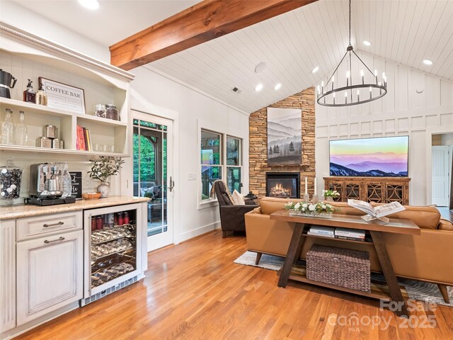 62 Blair Athel Pt, Waynesville, NC 28786 - living room featuring wine cooler, light wood-type flooring, a bar, wooden ceiling with exposed beams, and recessed lighting