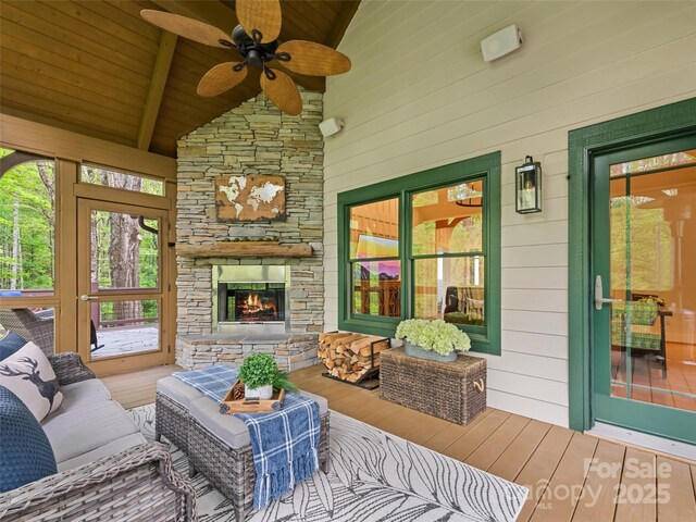 62 Blair Athel Pt, Waynesville, NC 28786 - sunroom / solarium with hardwood / wood-style floors, a ceiling fan, an outdoor living space with a fireplace, wooden ceiling with exposed beams, and high vaulted ceiling