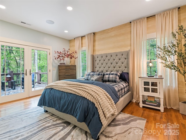 62 Blair Athel Pt, Waynesville, NC 28786 - bedroom featuring french doors, access to exterior, recessed lighting, multiple windows, and wood finished floors