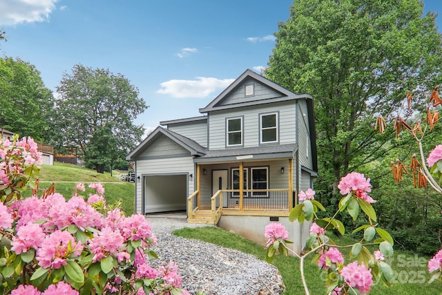12 Whipoorwill Way, Waynesville, NC 28786 - view of front facade featuring covered porch, gravel driveway, and an attached garage