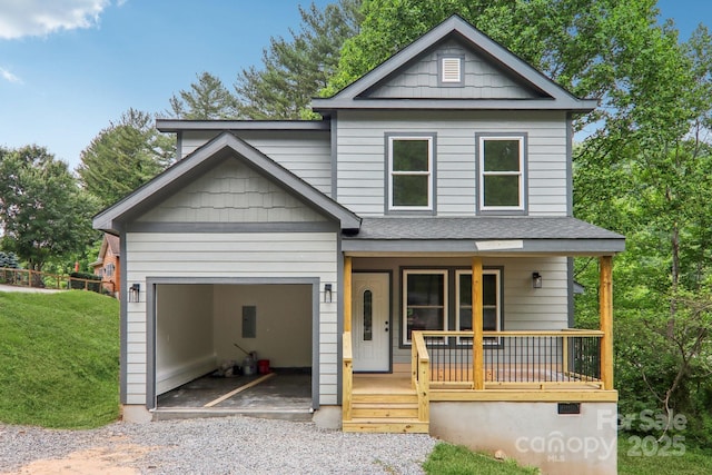 12 Whipoorwill Way, Waynesville, NC 28786 - view of front of property with a porch, gravel driveway, an attached garage, a shingled roof, and a front lawn