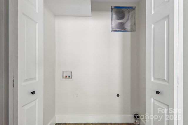 12 Whipoorwill Way, Waynesville, NC 28786 - washroom featuring hookup for a washing machine, baseboards, hookup for an electric dryer, and wood finished floors