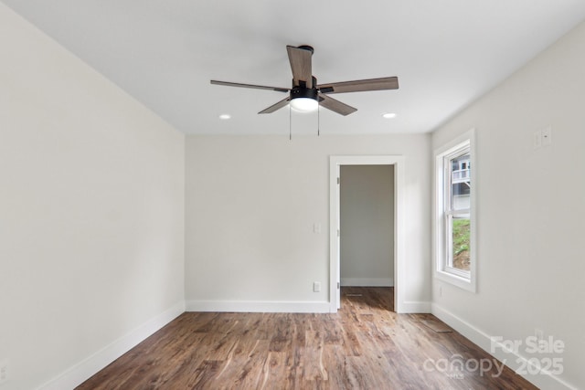 12 Whipoorwill Way, Waynesville, NC 28786 - empty room featuring wood finished floors, baseboards, ceiling fan, and recessed lighting