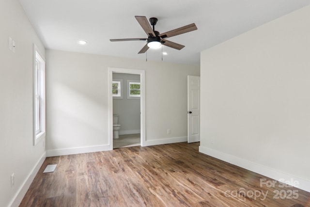 12 Whipoorwill Way, Waynesville, NC 28786 - unfurnished bedroom with wood finished floors, baseboards, recessed lighting, and ensuite bath