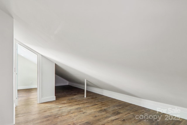 12 Whipoorwill Way, Waynesville, NC 28786 - additional living space with wood finished floors, lofted ceiling, and baseboards