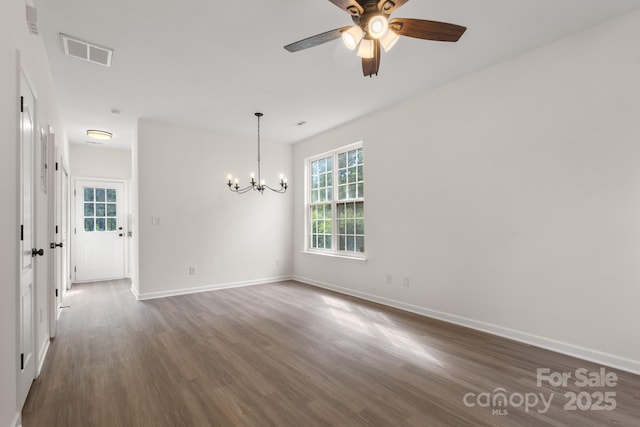 5529 Seths Dr, Charlotte, NC 28269 - empty room featuring dark wood-type flooring, a chandelier, a ceiling fan, and baseboards