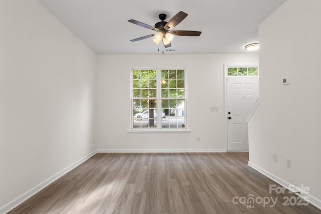 5529 Seths Dr, Charlotte, NC 28269 - unfurnished living room featuring wood finished floors, plenty of natural light, ceiling fan, and baseboards