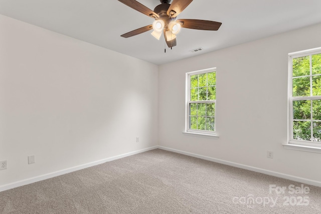 5529 Seths Dr, Charlotte, NC 28269 - carpeted spare room with baseboards, healthy amount of natural light, and a ceiling fan