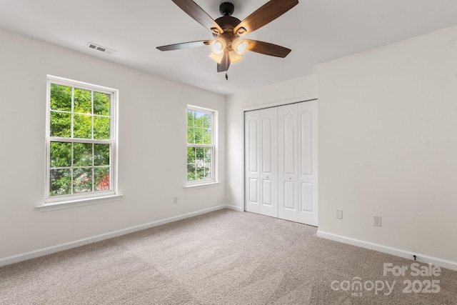 5529 Seths Dr, Charlotte, NC 28269 - unfurnished bedroom with baseboards, carpet, a closet, and ceiling fan