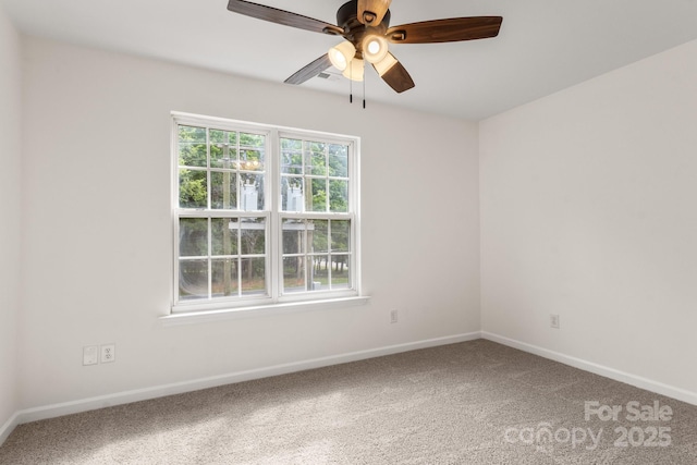 5529 Seths Dr, Charlotte, NC 28269 - unfurnished room with carpet floors, baseboards, and a ceiling fan