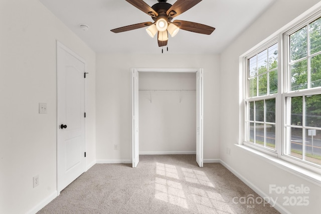 5529 Seths Dr, Charlotte, NC 28269 - unfurnished bedroom featuring multiple windows, carpet flooring, a closet, and baseboards