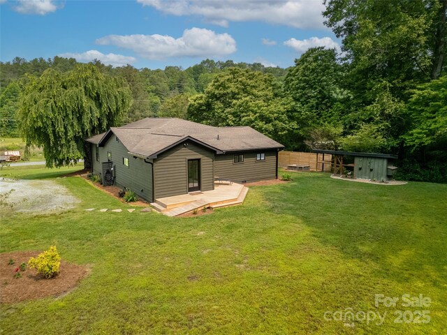 903 Middlefork Rd, Brevard, NC 28712 - back of house with a yard, a wooden deck, and an outbuilding