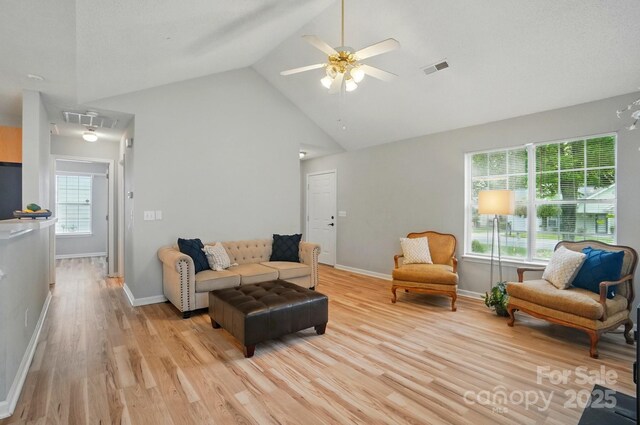 317 Cedarcroft Dr, Mooresville, NC 28115 - living area featuring light wood-type flooring, high vaulted ceiling, a ceiling fan, attic access, and baseboards